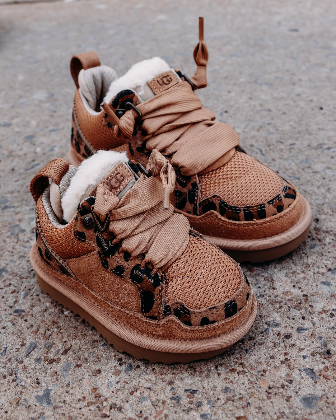 fur lined chestnut colored tennis shoe with leopard sheepskin details