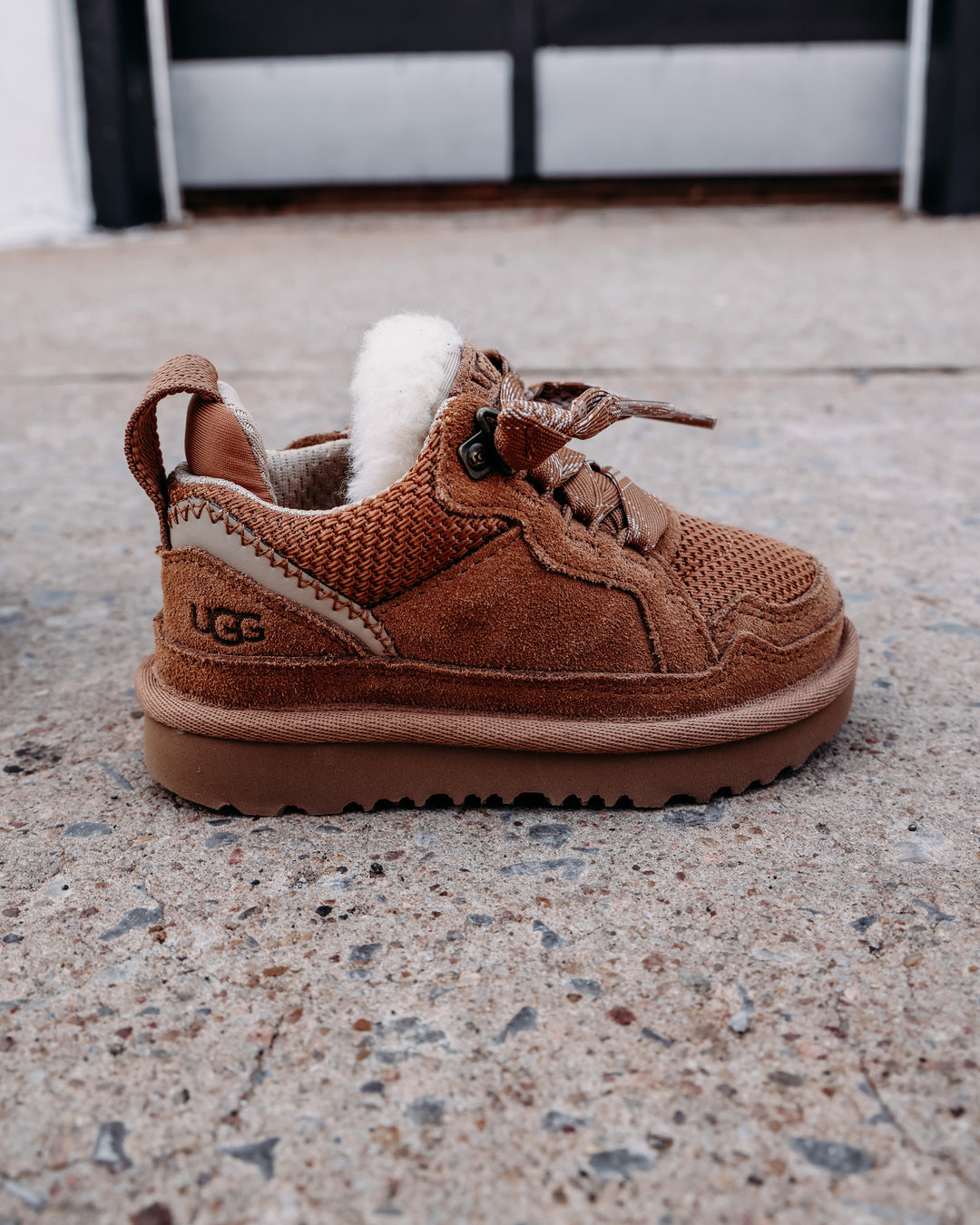 chestnut suede sneaker with plaid lace and UGG logo and fur details