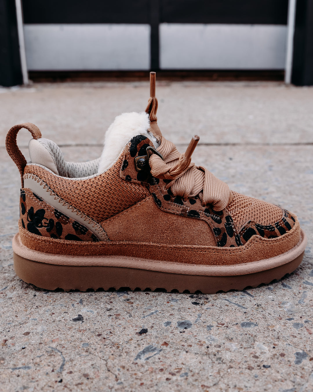 fur lined chestnut colored tennis shoe with leopard sheepskin details