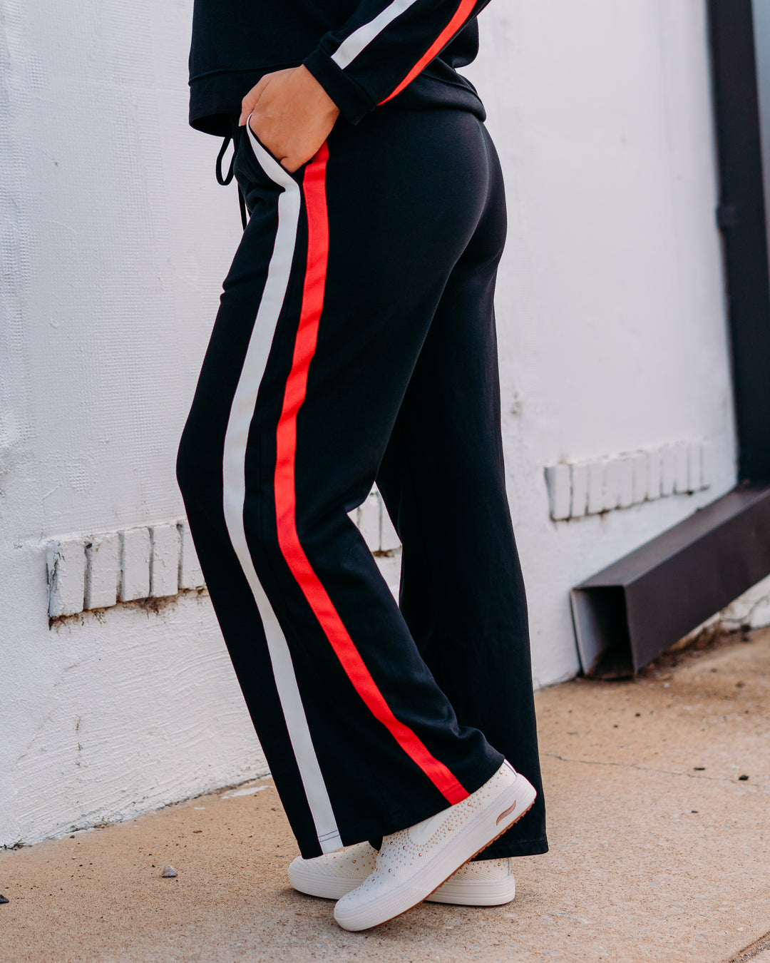 Jodifl: Track Pant in Black, Red, and Black
