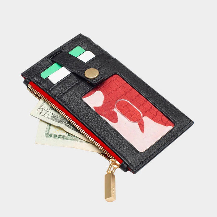 Hammitt 210 West wallet in black with gold zipper and red interior, open showing cards and cash