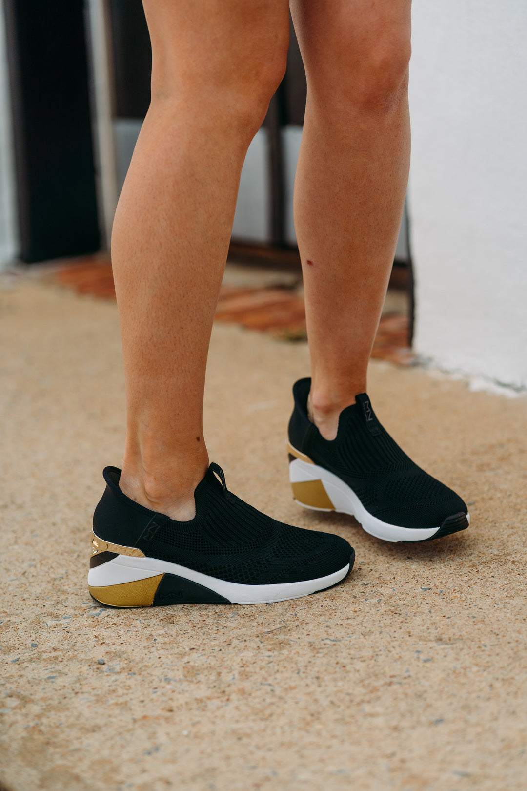 Skechers: A Wedge Crecent Sneaker in Black - The Vogue Boutique
