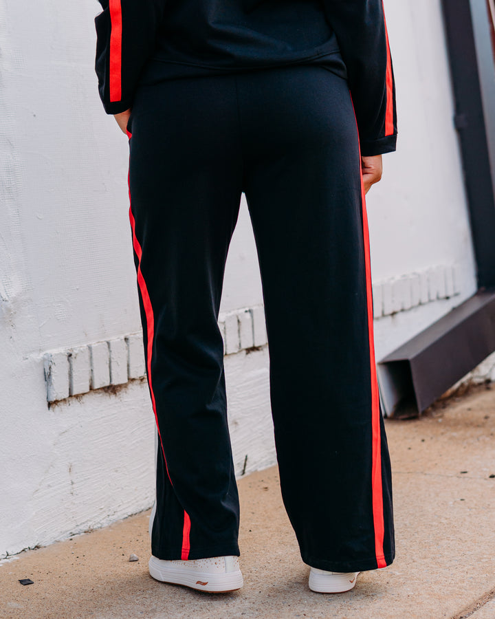 Jodifl: Track Pant in Black, Red, and Black