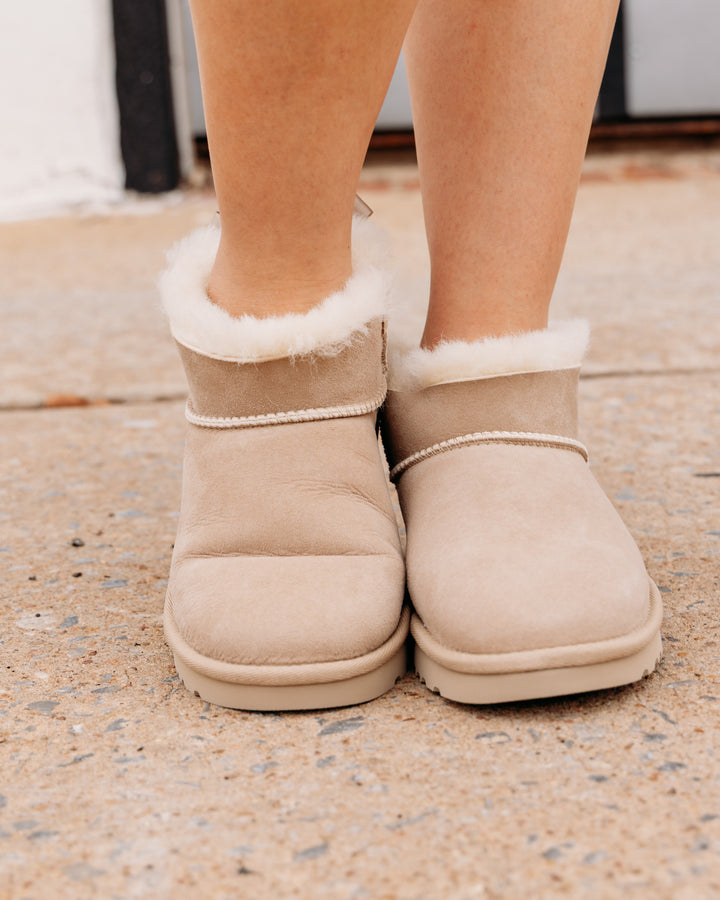 UGG: Ultra Mini Bailey Bow Boot in Sand (1185491)