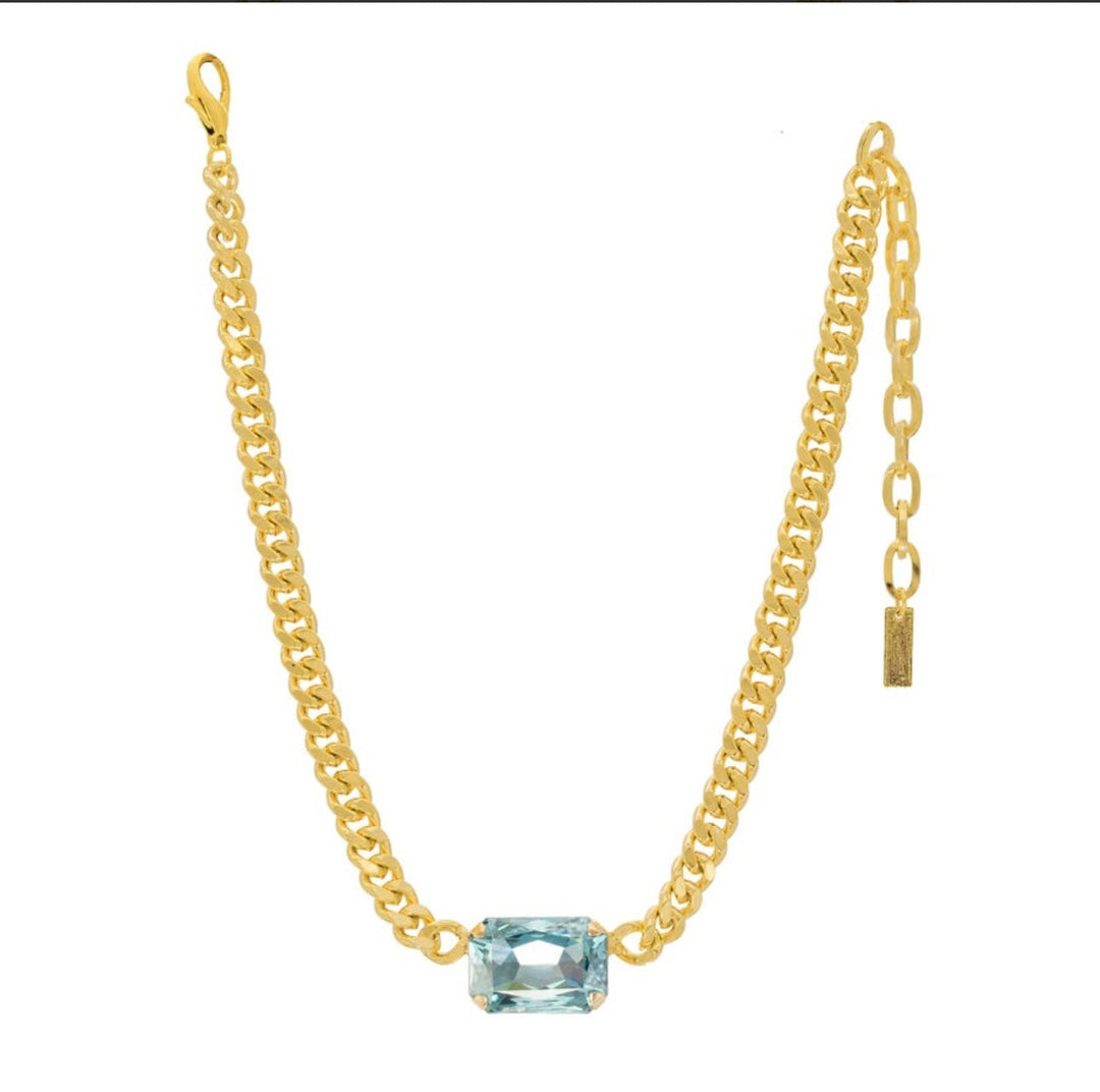 Gold curb chain necklace with rectangular light blue gemstone pendant