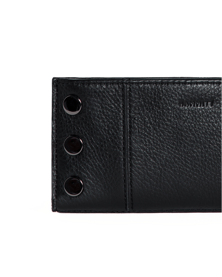 Close-up detail of Hammitt 110 North wallet in black leather with gunmetal studs