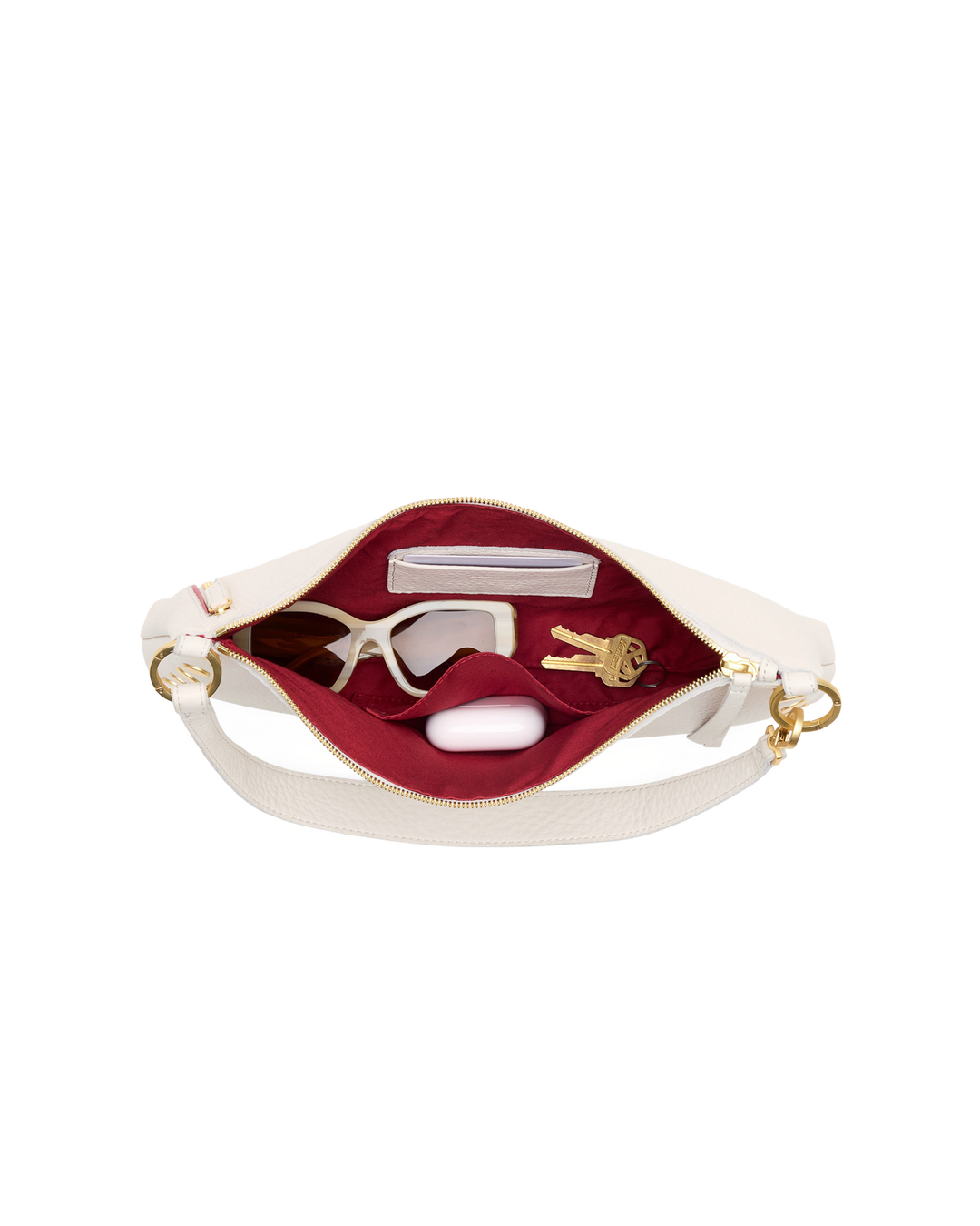 Hammitt Kyle Med bag in calla lily white open top view showing red interior with accessories
