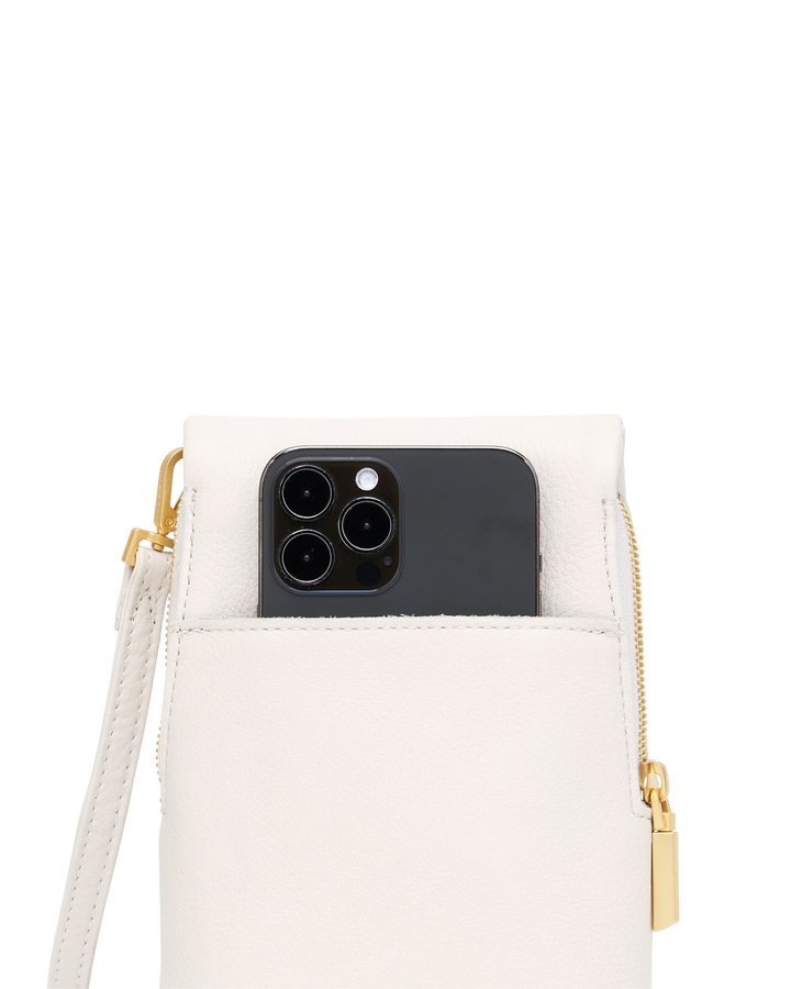 Hammitt VIP Mobile phone bag in calla lily white with gold zipper and iPhone shown