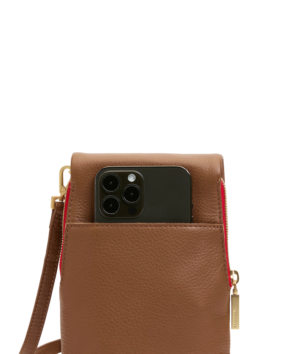 Hammitt VIP Mobile crossbody bag in mahogany pebble leather with red zip and iPhone shown inside