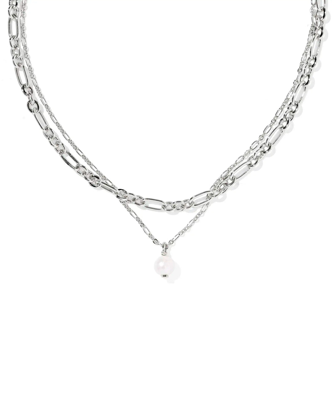 Layered silver chain necklace with a pearl pendant on a white background