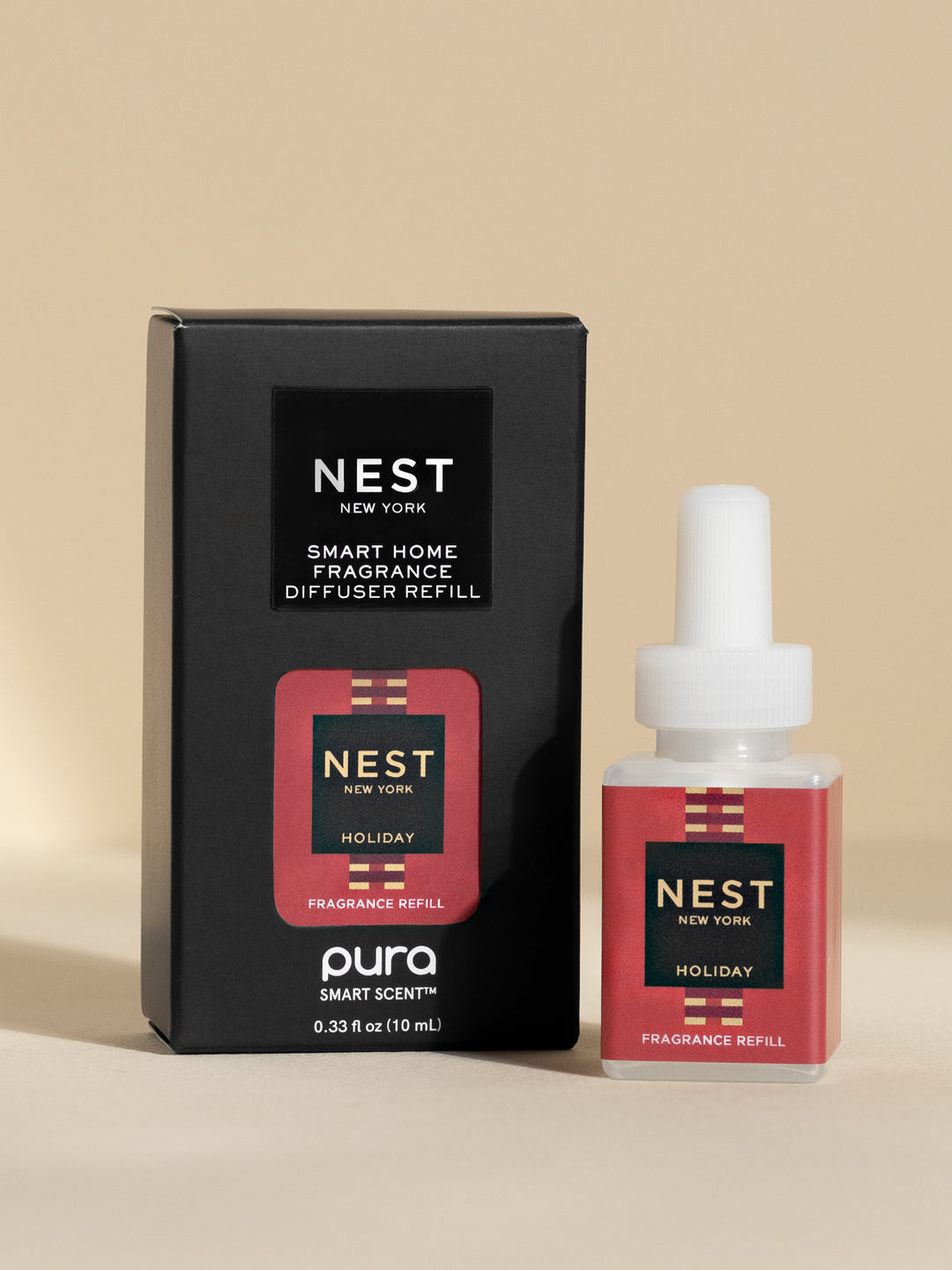 Nest New York Holiday fragrance refill pod and black box on neutral background