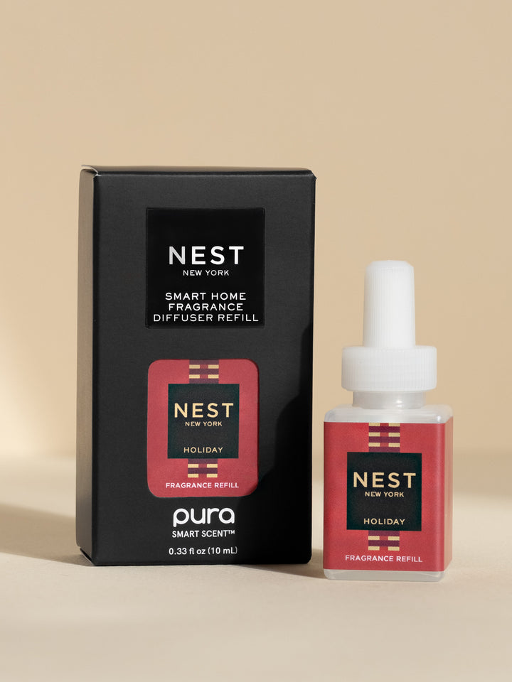 Nest New York Holiday fragrance refill pod and black box on neutral background