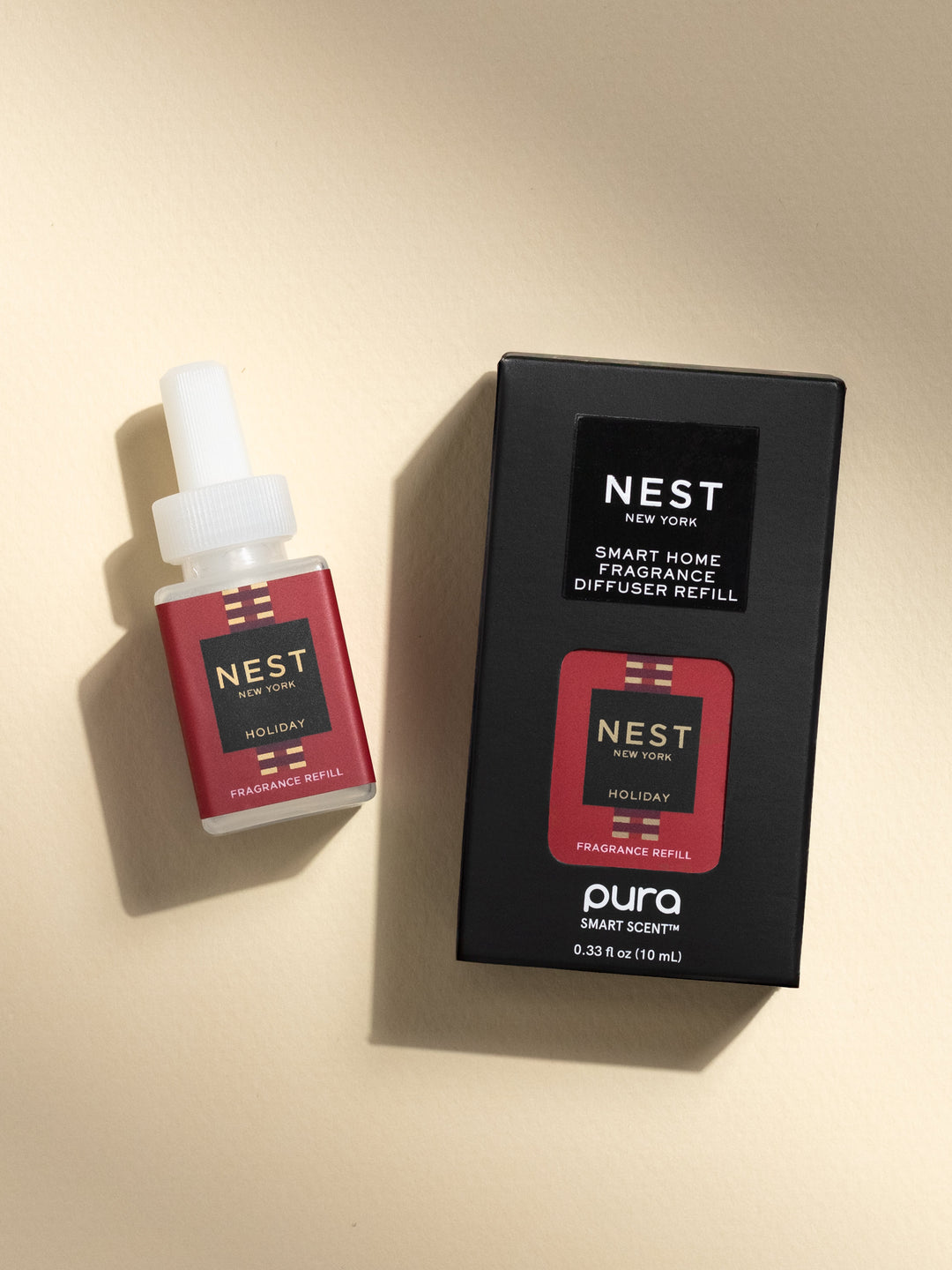 Nest New York Holiday fragrance refill pod and black box packaging by Pura Smart Scent