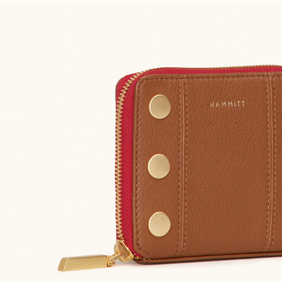Hammitt 5 North wallet in mahogany pebble leather with red zip and gold studs