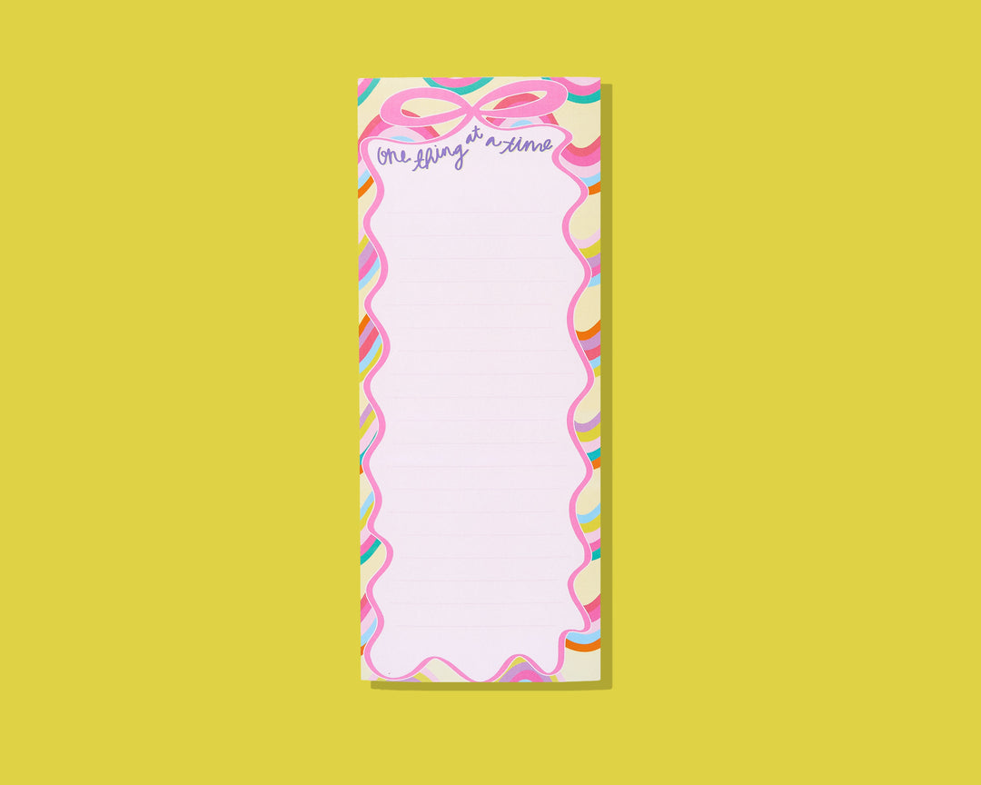 Taylor Elliott list pad with pink ribbon design and One Thing at a Time text