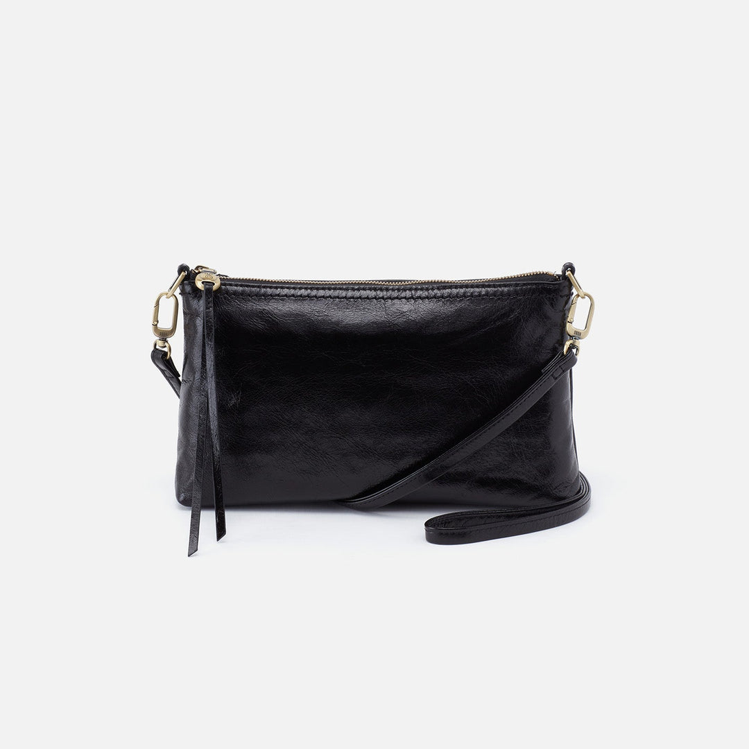 Hobo Darcy black leather crossbody bag with shoulder strap on white background