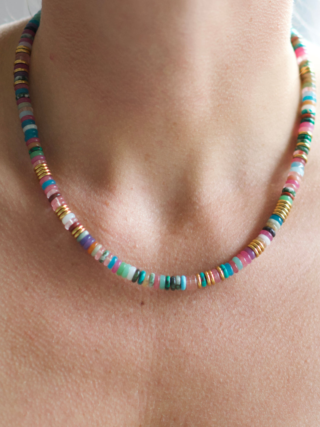 Farrah B VIBE necklace with multicolored stone disc beads and gold accents worn on model
