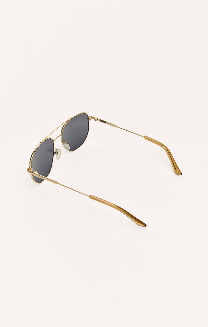 Z Supply Highway sunglasses in gold metal frame with dark polarized lenses, angled side view